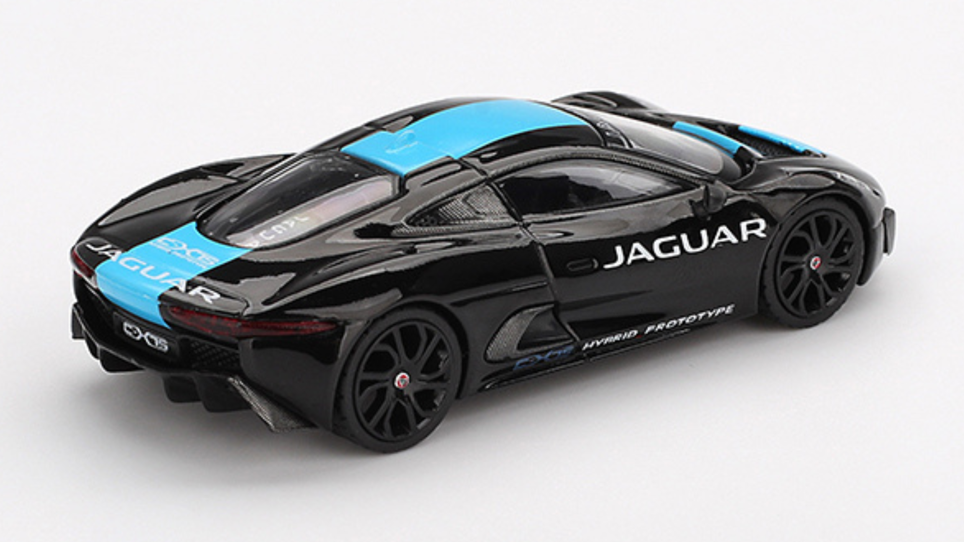 Model samochodu w kolorze czarnym z niebieskimi akcentami, z widocznym napisem \'JAGUAR\' na boku. Na tylnej części pojazdu znajdują się napisy \'C-X75\' i \'HYBRID PROTOTYPE\'.