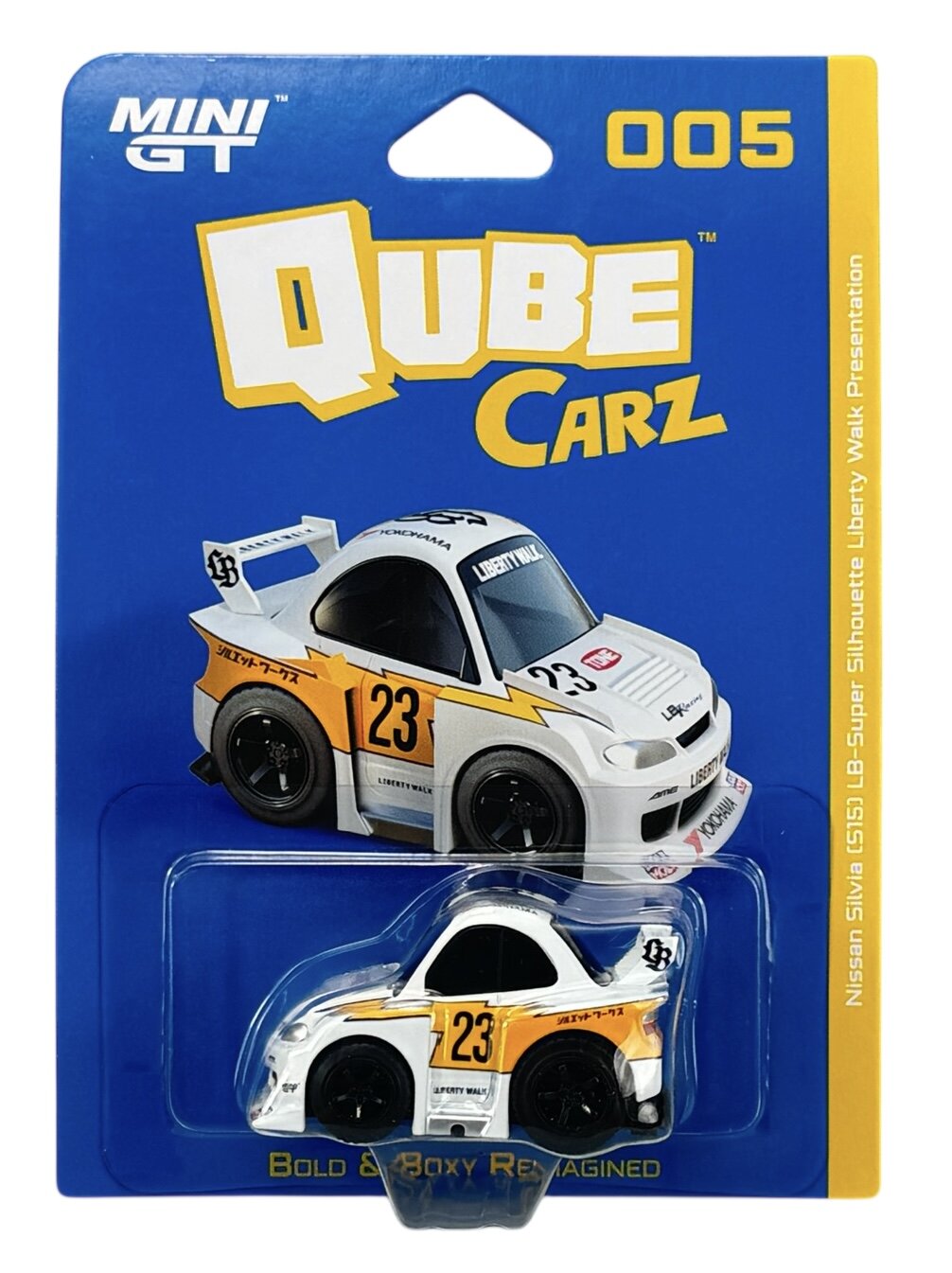 Opakowanie z modelem samochodu Mini GT Qube Carz, przedstawiające biały samochód wyścigowy z numerem 23 i napisami \'Liberty Walk\' oraz \'Yokohama\'. Na opakowaniu widnieje tekst: \'MINI GT\', \'QUBE Carz\', \'005\', \'Bold & Boxy Reimagined\'.