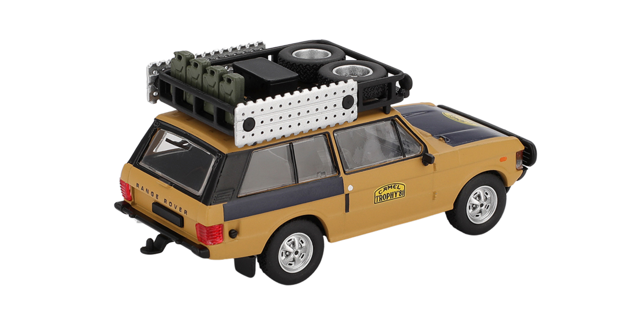 Model samochodu terenowego w kolorze żółtym z czarnymi elementami, z napisem \'Camel Trophy\' na drzwiach. Na dachu znajdują się dodatkowe akcesoria, w tym kanistry i koła zapasowe.