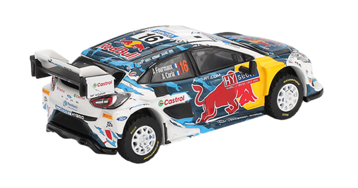 Model samochodu rajdowego z kolorowym wzorem i logotypami, w tym Red Bull i Castrol. Na bocznej szybie widoczne nazwiska: A. Fourmaux i A. Coria.