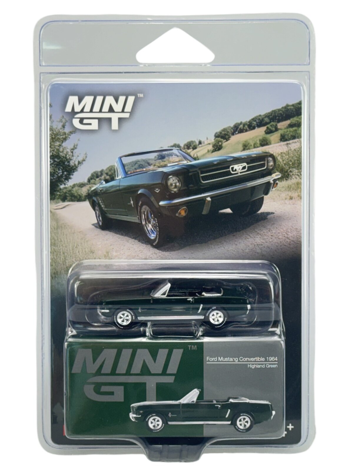 Opakowanie z modelem samochodu Mini GT przedstawiające zielony Ford Mustang Convertible 1964. Na opakowaniu widoczny jest napis \'MINI GT\' oraz zdjęcie rzeczywistego samochodu na tle drogi i zieleni.