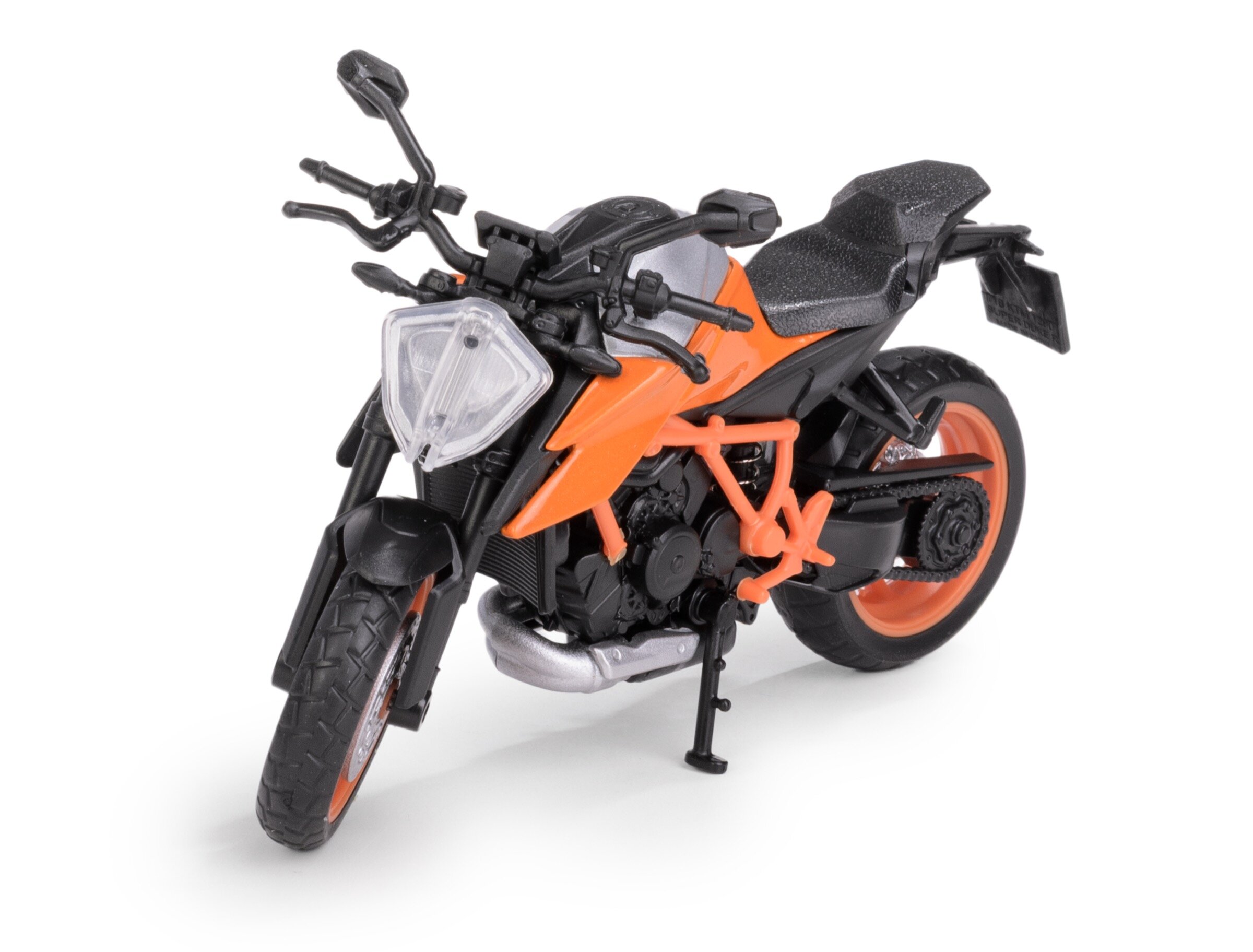 Model metalowy motocykla w kolorze pomarańczowym z czarnymi elementami, widoczny z przodu i z boku. Motocykl posiada szczegółowe elementy, takie jak kierownica, siedzenie i koła.