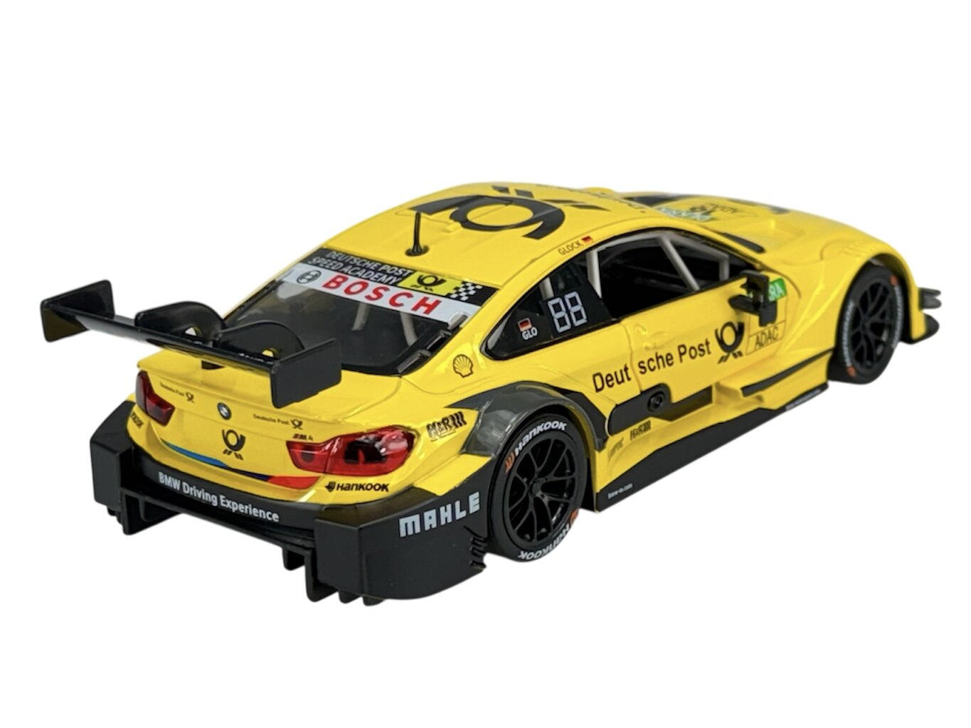 Żółty model samochodu wyścigowego z logo Deutsche Post i napisem \'BMW Driving Experience\' na tylnym zderzaku. Na dachu widoczne jest logo i napis \'BOSCH\'.