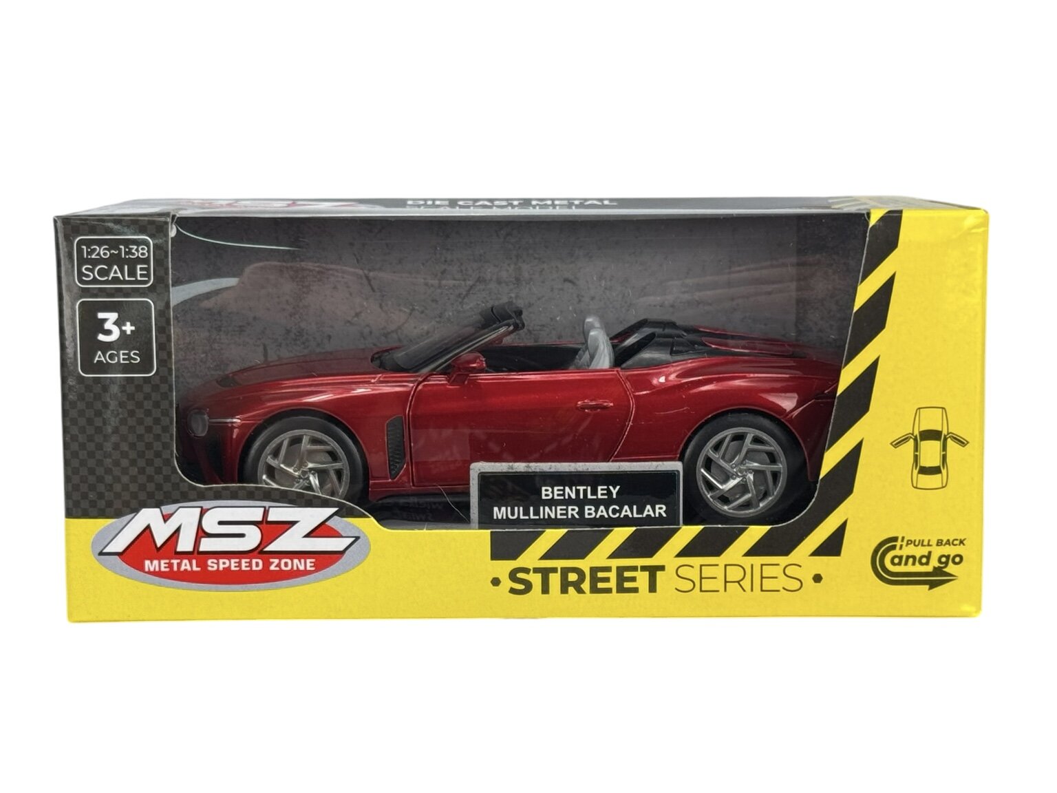 Model samochodu Bentley Mulliner Bacalar w kolorze czerwonym znajduje się w opakowaniu z napisem \'MSZ METAL SPEED ZONE STREET SERIES\'. Na opakowaniu widnieje również informacja \'1:26-1:38 SCALE\', \'3+ AGES\' oraz \'PULL BACK and go\'.