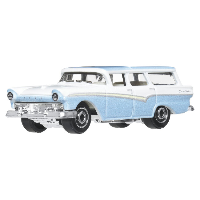 Model samochodu w kolorze niebiesko-białym z chromowanymi elementami i napisem \'Country Sedan\' na boku. Posiada szczegółowe wykończenia, takie jak reflektory i zderzaki.