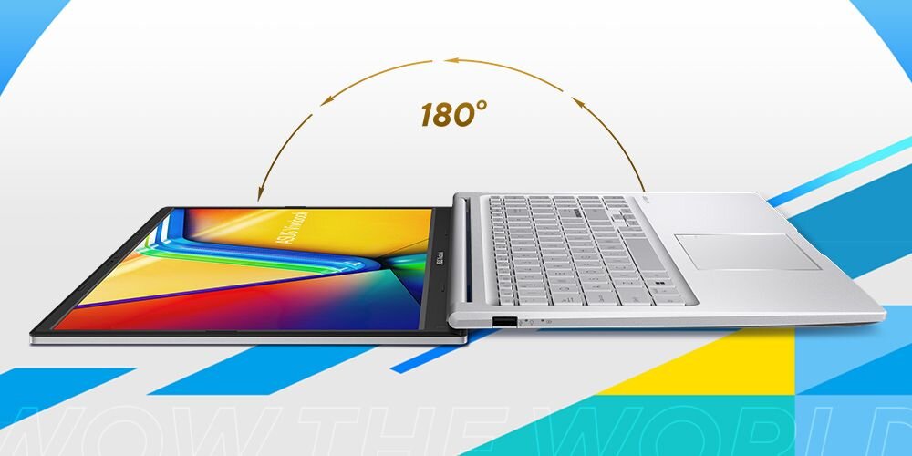 Laptop z ekranem otwartym na płasko pod kątem 180 stopni, z kolorowym wyświetlaczem i srebrną klawiaturą. Na ekranie widoczny jest napis \'180°\'.
