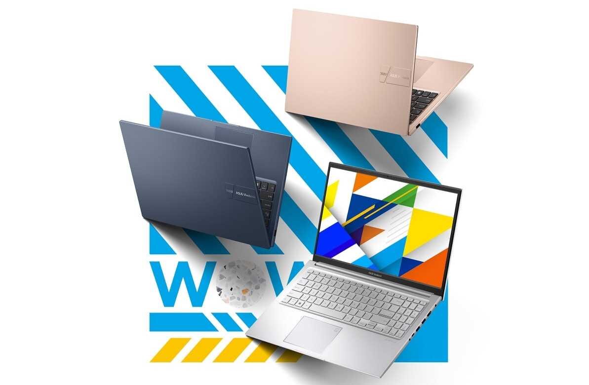 Obraz przedstawia trzy laptopy w różnych kolorach: różowym, niebieskim i srebrnym. Na ekranie srebrnego laptopa widoczny jest kolorowy wzór geometryczny, a w tle znajduje się niebiesko-żółty wzór z napisem \'WOW\'.