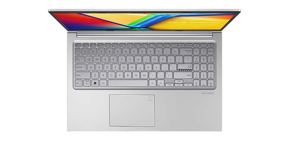 Obraz przedstawia otwarty laptop z widoczną klawiaturą i touchpadem. Na ekranie widoczny jest kolorowy pasek oraz napis \'ASUS Vivobook\'.