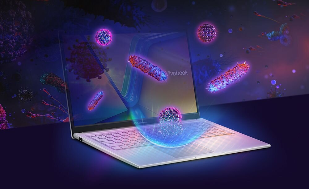 Na obrazie widoczny jest laptop z napisem \'Vivobook\' na ekranie, otoczony kolorowymi, abstrakcyjnymi kształtami przypominającymi mikroorganizmy. Tło jest ciemne z różnobarwnymi elementami.