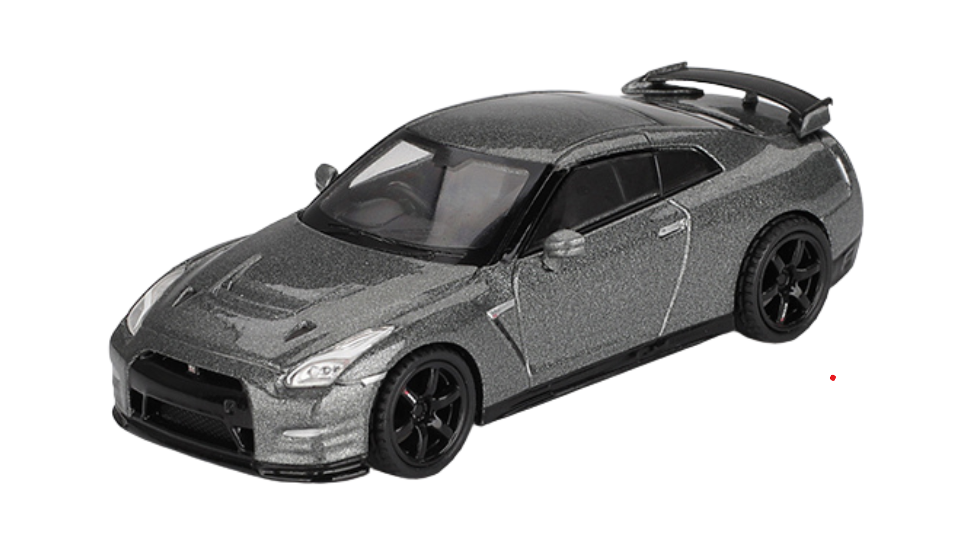 Model samochodu w skali 1:64, przedstawiający srebrny sportowy pojazd z czarnymi felgami i dużym tylnym spojlerem.