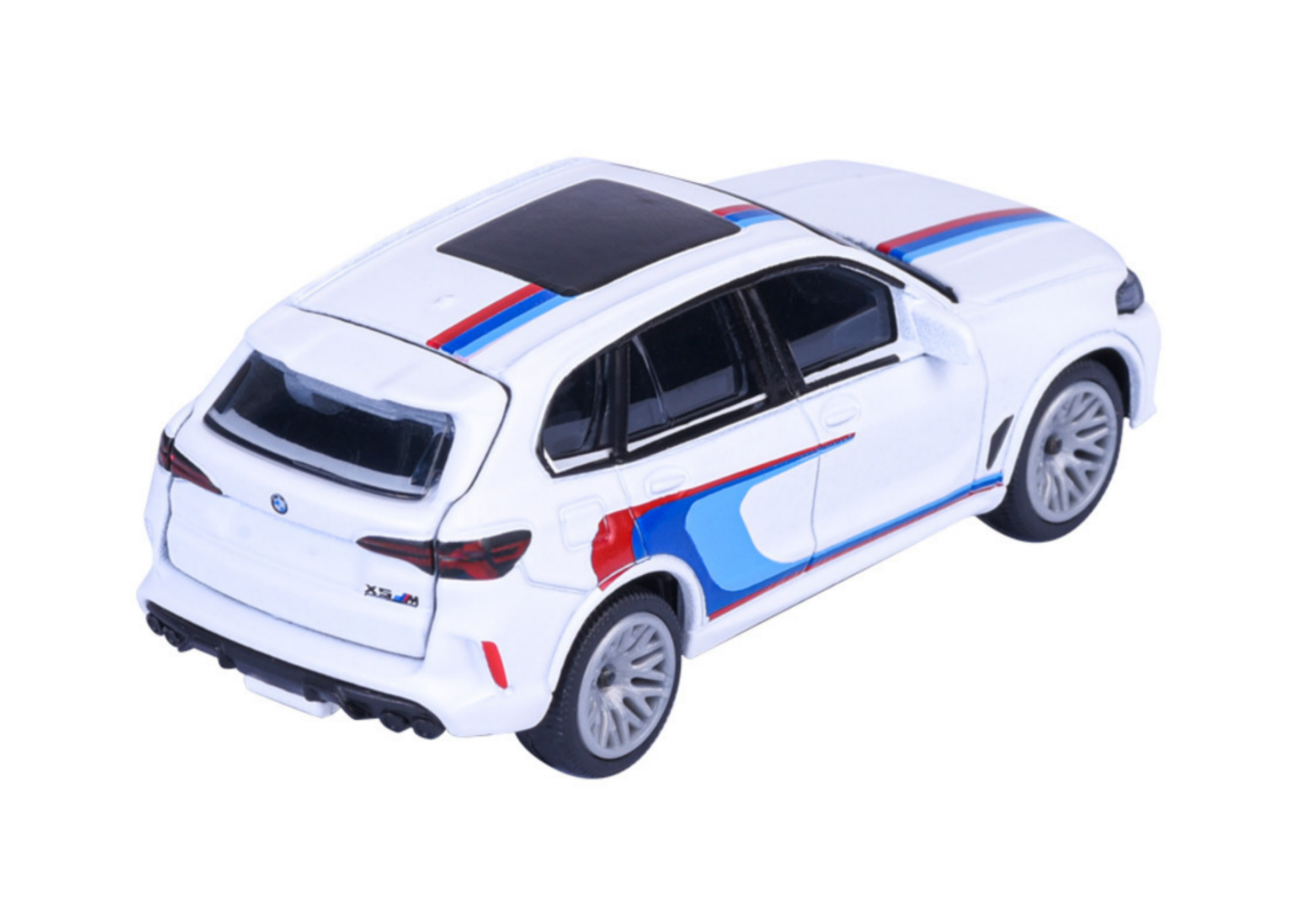 Model samochodu w skali 1:64 przedstawiający biały SUV z kolorowymi paskami na karoserii. Na tylnej klapie widoczny jest napis \'X5M\'.