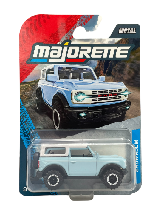 Opakowanie z metalowym modelem samochodu w kolorze niebieskim, przedstawiające pojazd terenowy. Na opakowaniu widnieje logo \'Majorette\' oraz napis \'METAL\'.