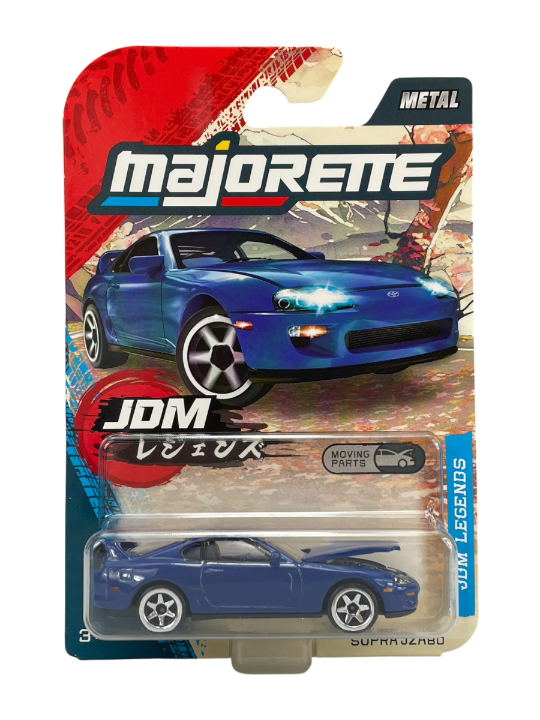 Opakowanie modelu samochodu Majorette z niebieskim autem Toyota Supra JZA80 w skali 1:64. Na opakowaniu widnieje napis \'JDM Legends\' oraz \'Moving Parts\'.