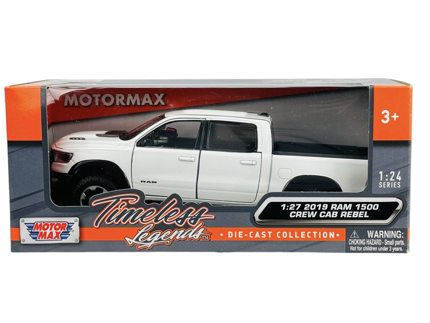 Opakowanie modelu samochodu w skali 1:27, przedstawiające biały Dodge RAM 1500 Crew Cab Rebel. Na opakowaniu widoczne są napisy: \'MOTORMAX\', \'Timeless Legends\', \'1:27 2019 RAM 1500 CREW CAB REBEL\', oraz ostrzeżenie o małych częściach dla dzieci poniżej 3 lat.