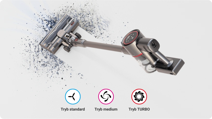 Odkurzacz w trakcie pracy, zbierający drobinki z powierzchni. Na dole widoczne są ikony z napisami: Tryb standard, Tryb medium, Tryb TURBO.