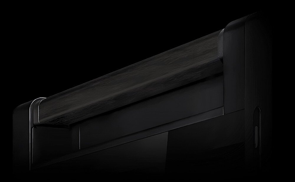 Obraz przedstawia fragment obudowy w ciemnym kolorze z drewnianym elementem na górze. Tło jest czarne, co podkreśla elegancki design produktu.