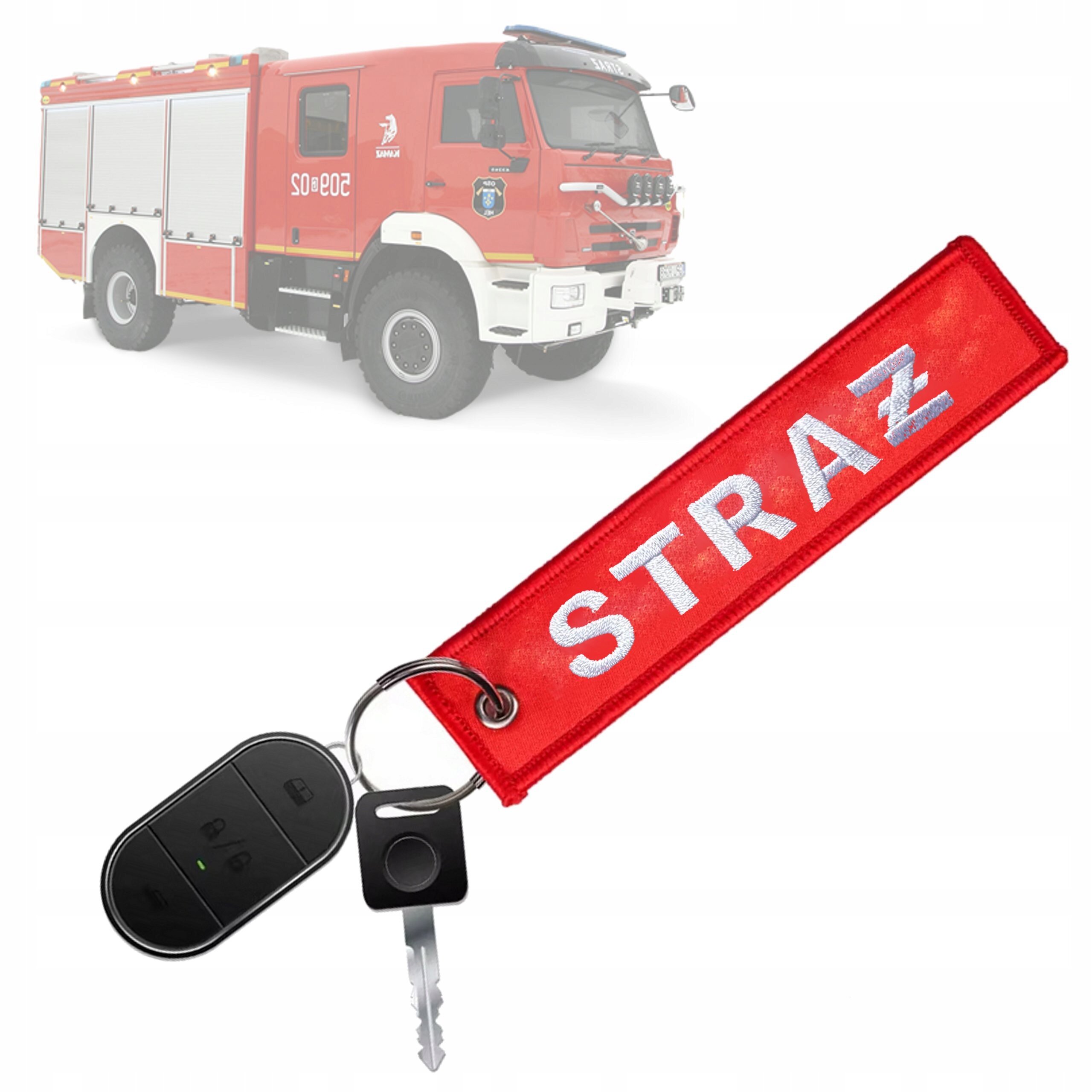 Na obrazie widoczny jest czerwony brelok z napisem \'STRAŻ\' oraz kluczyk z pilotem. W tle znajduje się czerwony wóz strażacki.