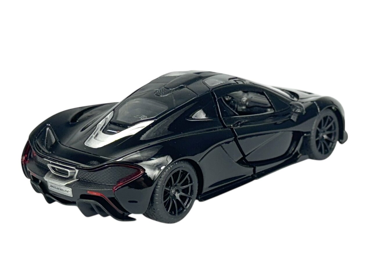 Czarny model samochodu sportowego z widocznymi szczegółami karoserii i felgami. Na tablicy rejestracyjnej widnieje napis \'McLaren\'.