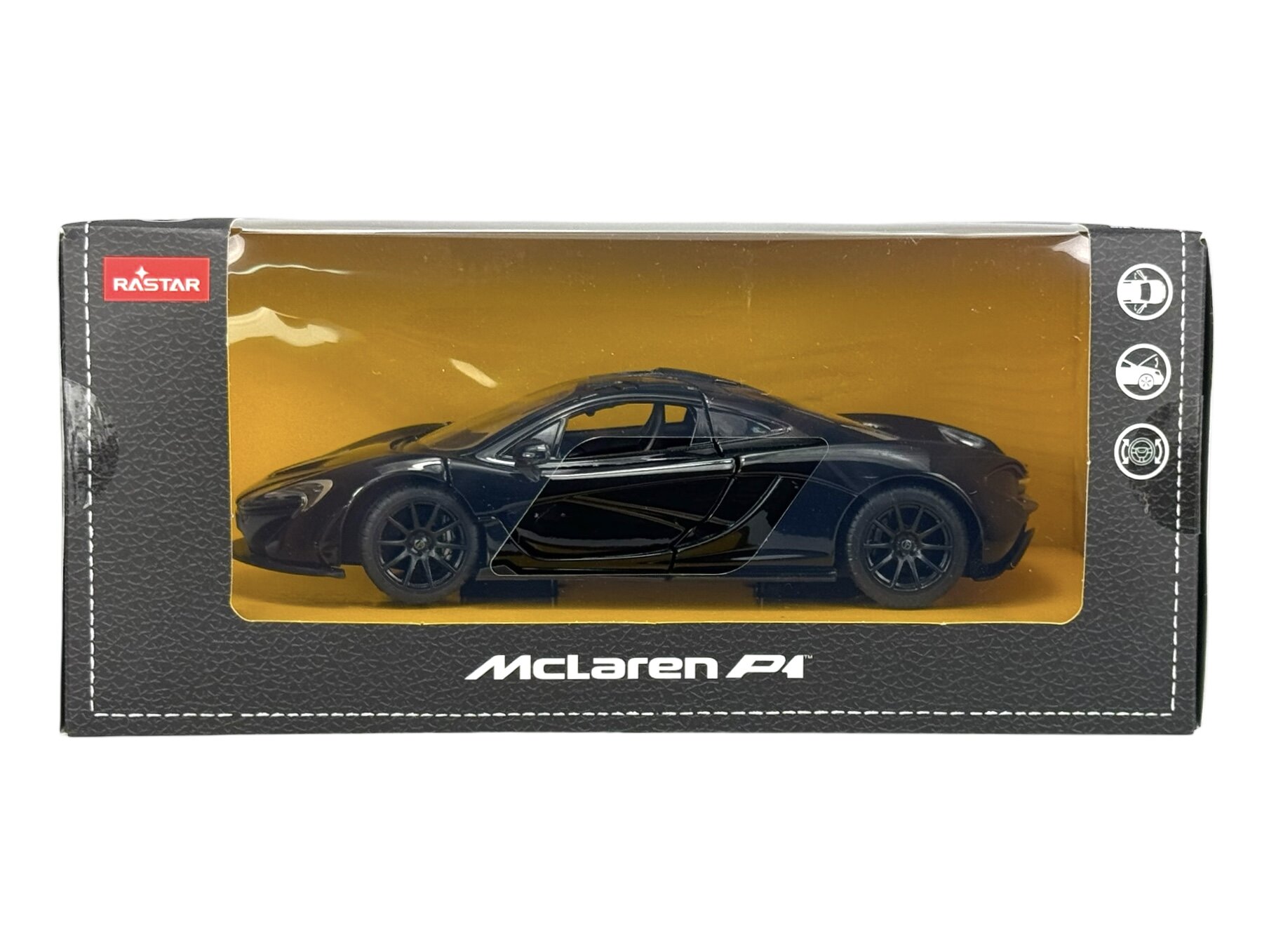 Czarny model samochodu McLaren P1 w skali 1:24 znajduje się w przezroczystym opakowaniu z logo Rastar. Na opakowaniu widnieje napis \'McLaren P1\'.