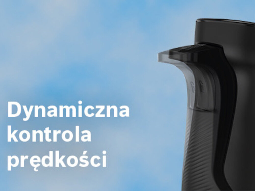Na obrazie widoczny jest fragment czarnego urządzenia z przyciskiem. Obok znajduje się tekst: \'Dynamiczna kontrola prędkości\'.
