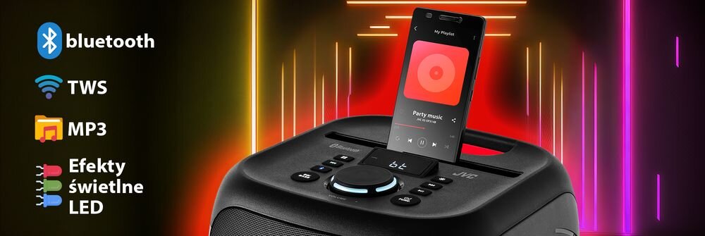 Głośnik JVC z panelem sterowania, na którym znajduje się smartfon z aplikacją muzyczną. Obok widoczne są ikony i teksty: \'bluetooth\', \'TWS\', \'MP3\', \'Efekty świetlne LED\'.