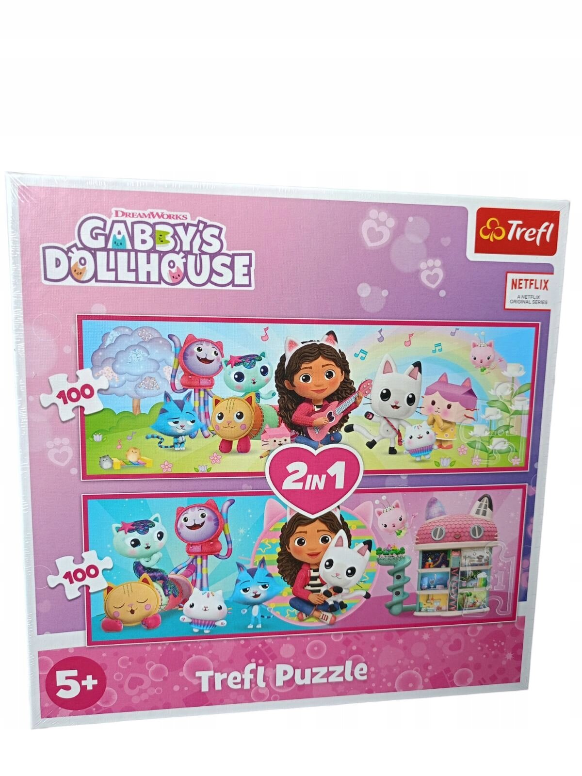 Opakowanie puzzli \'Gabby\'s Dollhouse 2x100 el.\' marki Trefl z kolorowymi ilustracjami postaci z bajki. Na opakowaniu widoczne są napisy: \'2 in 1\', \'5+\', \'Trefl Puzzle\' oraz logo Trefl i Netflix.