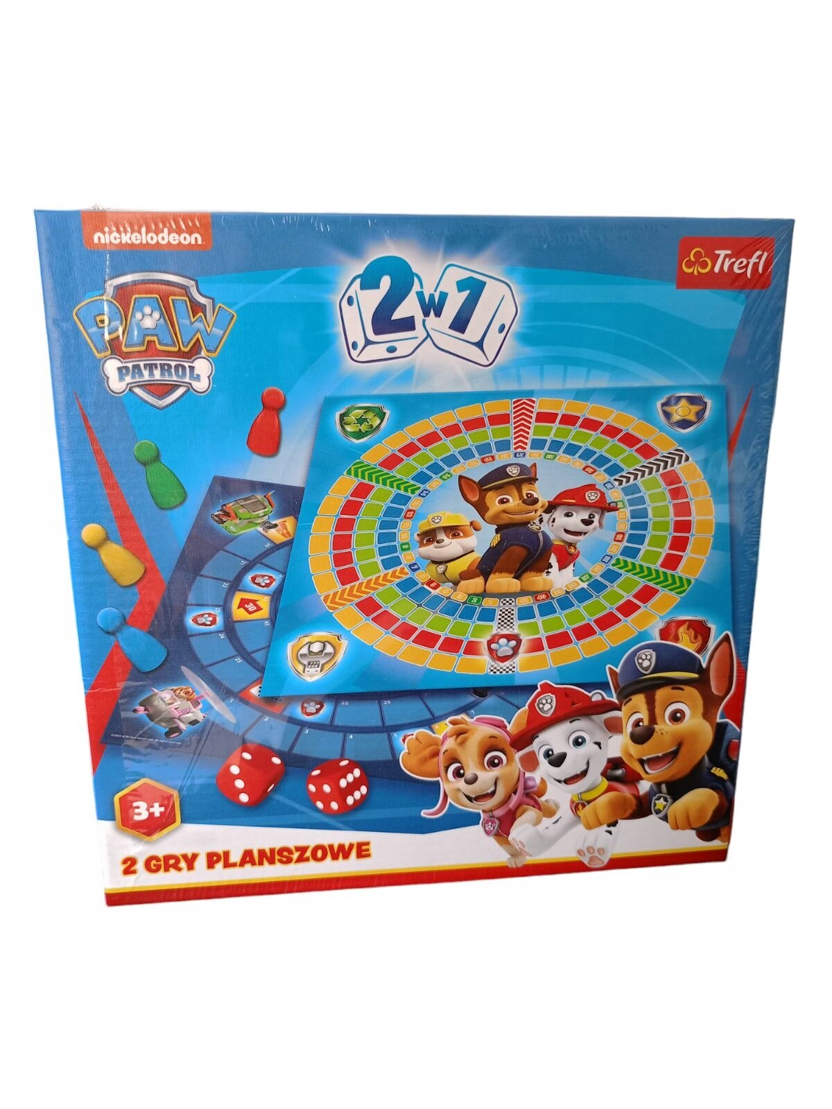 Opakowanie gry planszowej \'2w1\' z motywem \'Psi Patrol\', zawiera kolorową planszę z postaciami z bajki oraz pionki i kostki do gry. Na opakowaniu widnieje logo \'nickelodeon\' i \'Trefl\', a także napis \'2 GRY PLANSZOWE\'.