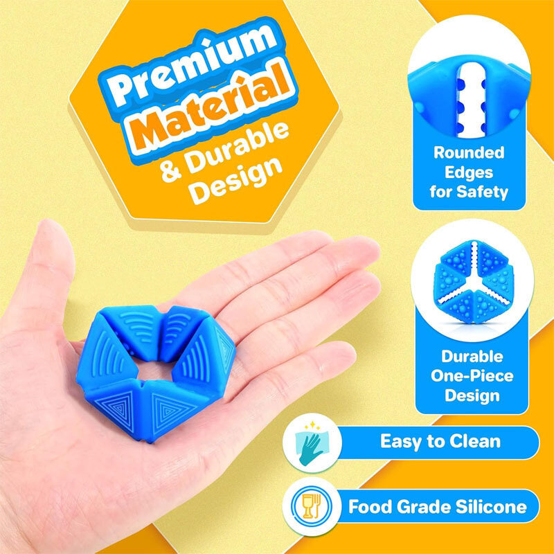 Na dłoni znajduje się niebieska sensoryczna kostka z fakturami. Obok widoczne są napisy: \'Premium Material & Durable Design\', \'Rounded Edges for Safety\', \'Durable One-Piece Design\', \'Easy to Clean\', \'Food Grade Silicone\'.