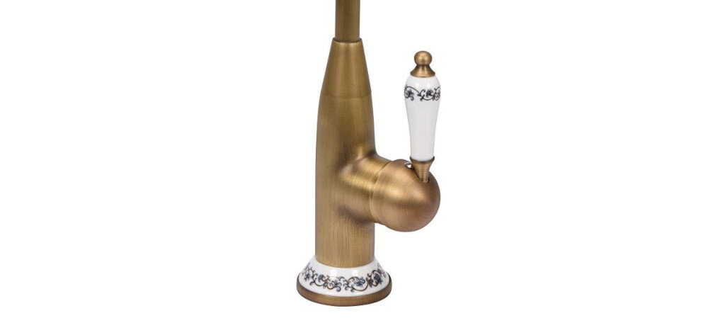 Bateria w kolorze brązowym z białymi elementami ozdobionymi czarnymi wzorami. Ma elegancki, klasyczny design z pionowym uchwytem.