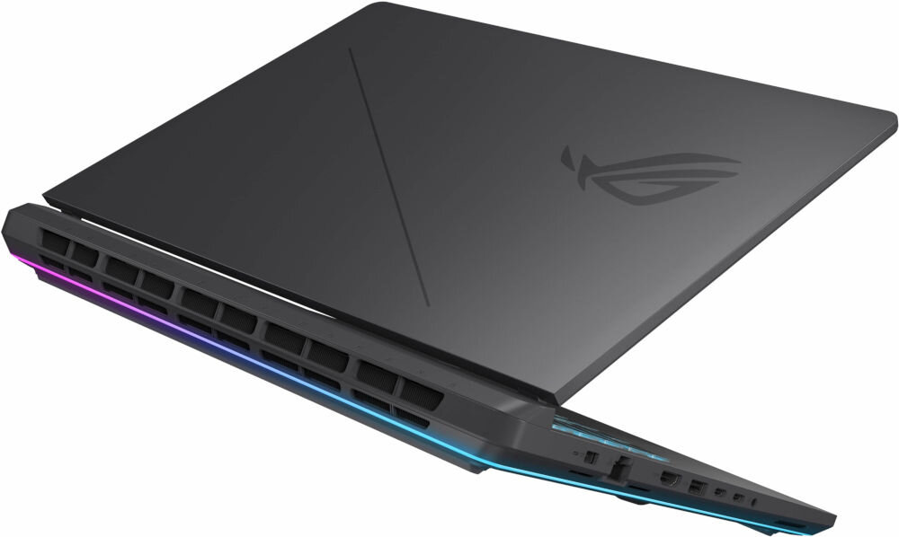 Laptop z zamkniętą pokrywą, widoczny z tyłu, z podświetleniem RGB na krawędzi. Na pokrywie znajduje się logo w kształcie stylizowanej litery \'R\'.