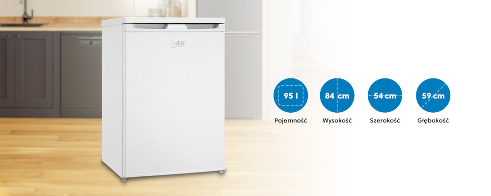 Na obrazie znajduje się biała zamrażarka z logo \'beko\' w kuchni. Obok zamrażarki widoczne są informacje: \'95 l Pojemność\', \'84 cm Wysokość\', \'54 cm Szerokość\', \'59 cm Głębokość\'.