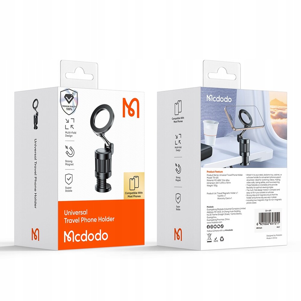 Na obrazie widoczne są dwa opakowania produktu \'Universal Travel Phone Holder\' marki Mcdodo. Opakowania zawierają zdjęcia uchwytu magnetycznego na telefon oraz informacje o jego funkcjach, takich jak \'Multi-Fold Design\', \'Strong Magnet\' i \'Super Stable\'.