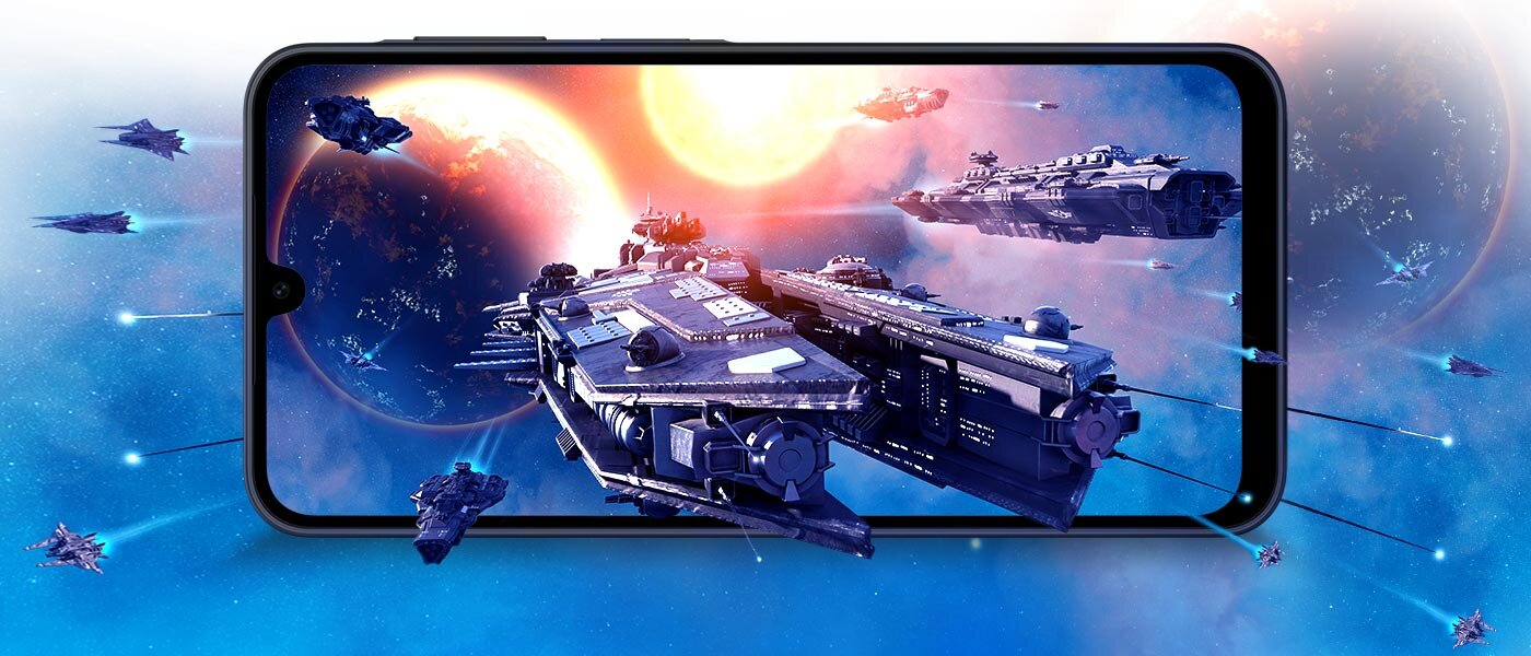płynna rozrywka na dużym ekranie Smartfon wyświetla grafikę przedstawiającą kosmiczne statki na tle planet i gwiazd. Obraz jest dynamiczny i kolorowy, z dominującymi odcieniami niebieskiego i pomarańczowego.