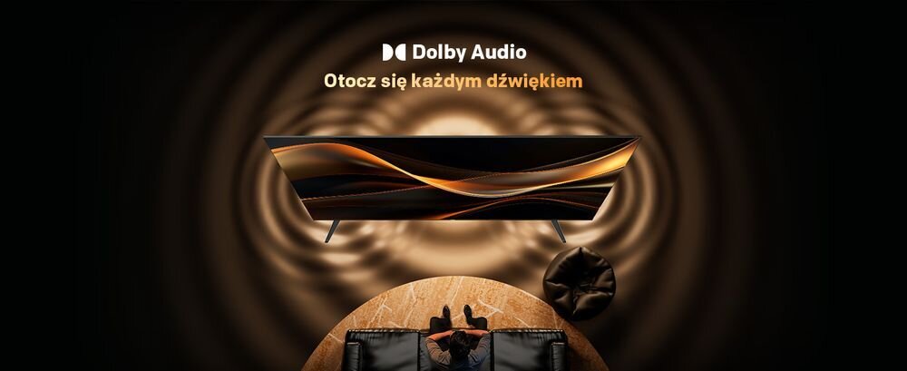 Obraz przedstawia telewizor z dynamicznymi, falującymi wzorami na ekranie. Nad telewizorem widnieje napis \'Dolby Audio Otocz się każdym dźwiękiem\'.