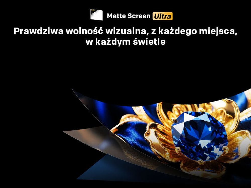 Obraz przedstawia napis \'Matte Screen Ultra\' oraz \'Prawdziwa wolność wizualna, z każdego miejsca, w każdym świetle\'. W dolnej części widoczny jest duży, niebieski klejnot otoczony złotymi elementami na ciemnym tle.
