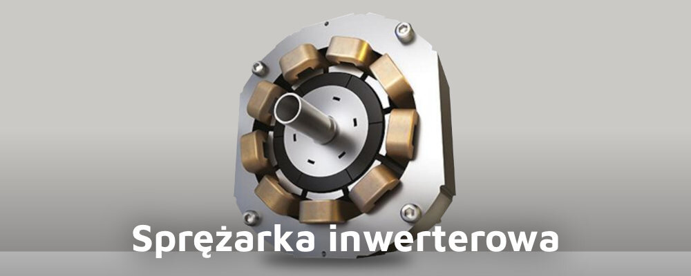 Obraz przedstawia sprężarkę inwerterową z widocznymi elementami konstrukcyjnymi. Na dole znajduje się napis: \'Sprężarka inwerterowa\'.