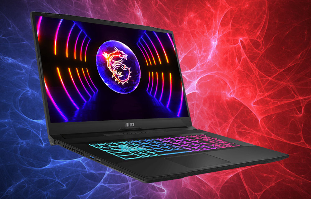 Laptop z podświetlaną klawiaturą i ekranem wyświetlającym kolorowe wzory z logo smoka. Tło jest w odcieniach czerwieni i niebieskiego z abstrakcyjnymi wzorami.