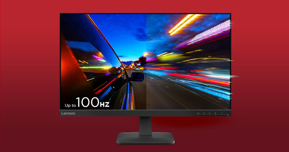 Monitor wyświetla dynamiczny obraz nocnej ulicy z rozmytymi światłami. Na ekranie widoczny jest napis \'Up to 100Hz\', a na ramce logo \'Lenovo\'.