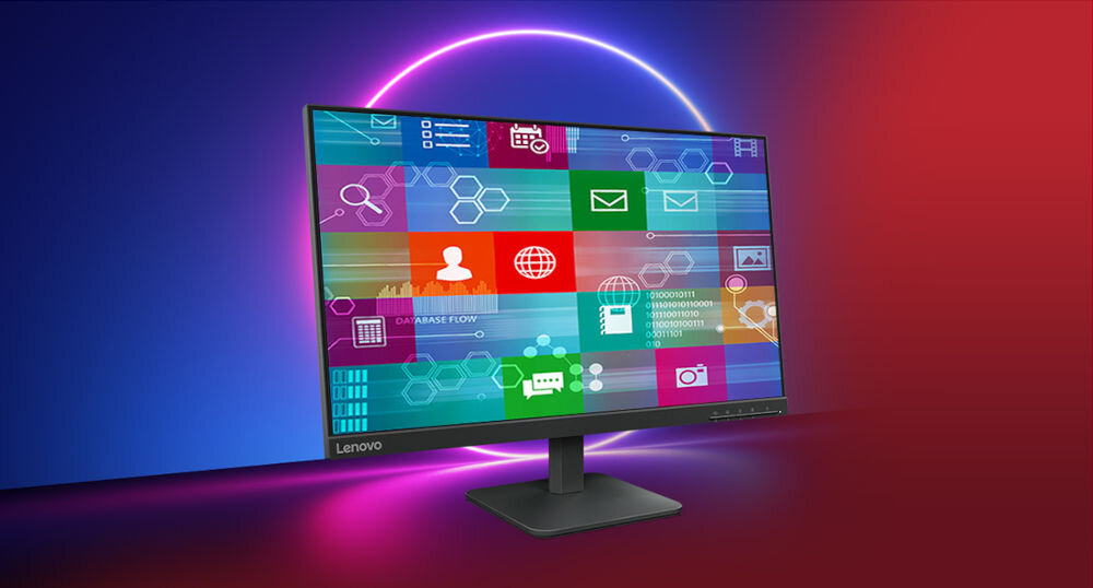 Monitor z wyświetlaczem pełnym kolorowych ikon i grafik, z logo Lenovo na ramce. Tło jest gradientowe, przechodzące od niebieskiego do czerwonego, z jasnym okręgiem za monitorem.