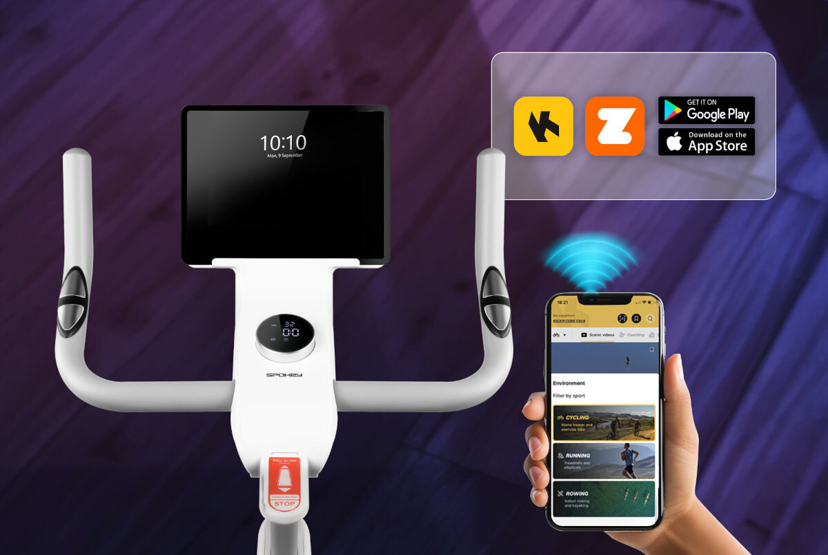 Rower elektromagnetyczny z wyświetlaczem pokazującym godzinę 10:10 oraz smartfonem z aplikacją sportową. Obok widoczne są ikony aplikacji i sklepów Google Play oraz App Store.