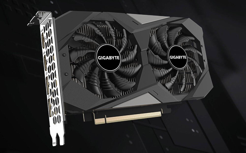 Komputer MAD DOG VENTUM200ARGB-A02DR16 Ujęcie karty graficznej z dwoma dużymi wentylatorami z logo 'GIGABYTE' umieszczonymi na czarnej obudowie oraz metalowym panelem z tyłu z otworami w kształcie plastra miodu i zestawem portów wideo