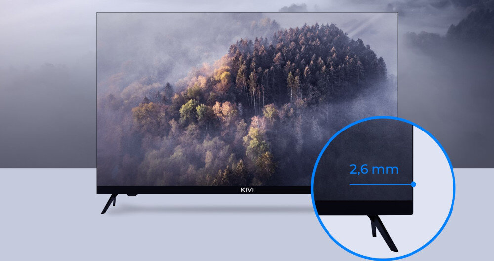 Telewizor z cienką ramką, na ekranie wyświetlany jest obraz lasu w mglistym otoczeniu. Obok widoczny jest okrągły wskaźnik z napisem \'2,6 mm\'.