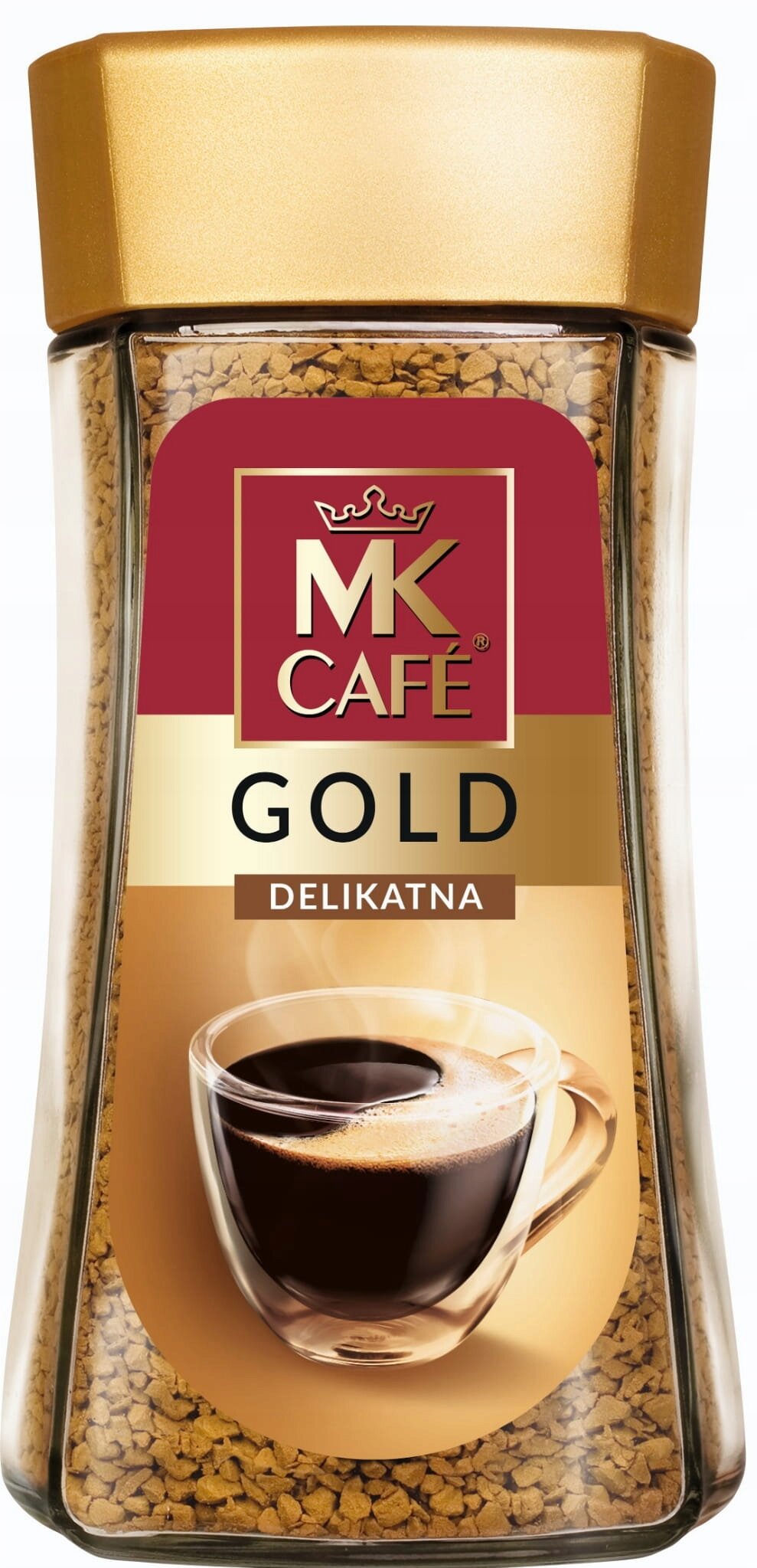 Szklany słoik z kawą rozpuszczalną, z etykietą MK Café Gold Delikatna i obrazkiem filiżanki kawy.
