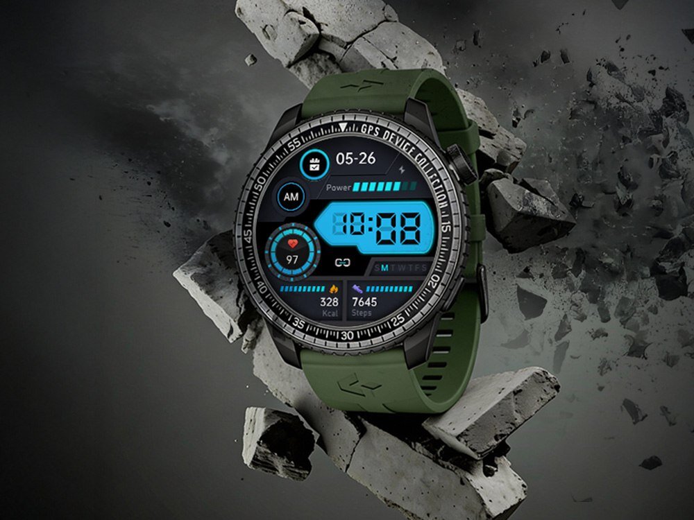 Smartwatch z zielonym paskiem wyświetla na ekranie cyfrowym godzinę 10:08, datę 05-26 oraz informacje o krokach i spalonych kaloriach. W tle widoczne są unoszące się kawałki betonu.