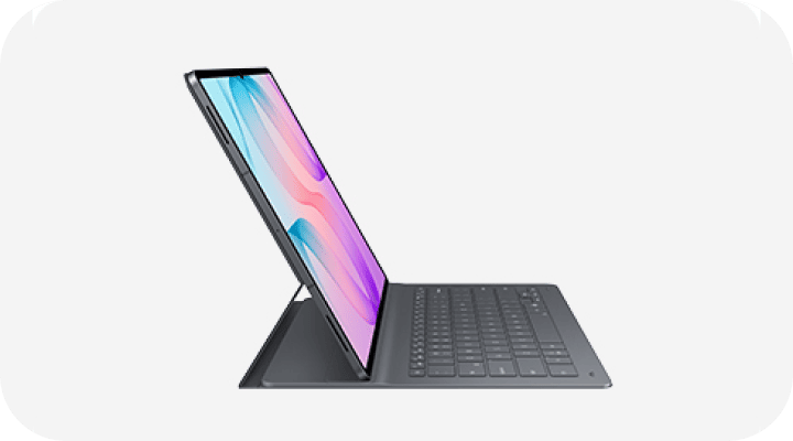 Tablet z dużym ekranem jest ustawiony na klawiaturze, wyświetlając kolorowy obraz na ekranie. Obudowa jest szara, a urządzenie wygląda na smukłe i nowoczesne.