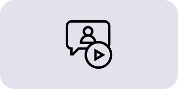 Ikona przedstawia dymek dialogowy z sylwetką osoby oraz symbol odtwarzania wideo na szarym tle.