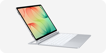 Packshoot Pro Keyboard Tablet z klawiaturą w kolorze srebrnym, wyświetlający kolorowy wzór na ekranie. Urządzenie jest ustawione w pozycji otwartej, przypominającej laptopa.