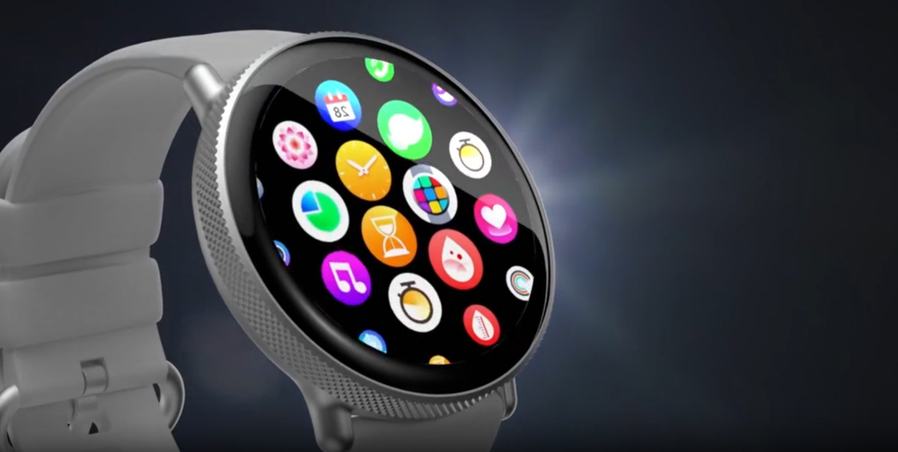 Smartwatch z okrągłym wyświetlaczem, na którym widoczne są kolorowe ikony aplikacji. Pasek zegarka jest jasny, a obudowa ma metaliczny wygląd.