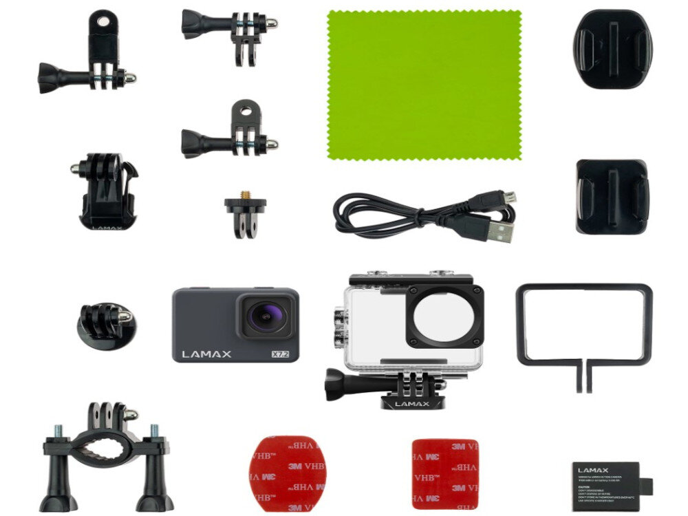 Na obrazie znajduje się zestaw akcesoriów do kamery sportowej, w tym kamera LAMAX X7.2, obudowa wodoszczelna, różne uchwyty, kabel USB, ściereczka oraz bateria. Widoczne są również elementy montażowe i naklejki 3M VHB.