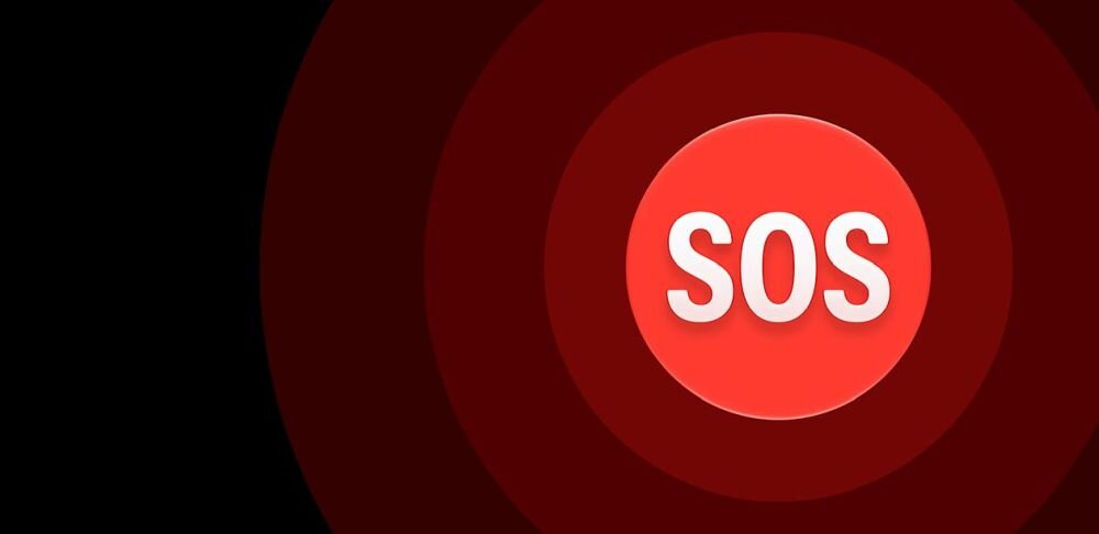 Obraz przedstawia czerwony okrąg z białym napisem \'SOS\' na ciemnym tle z koncentrycznymi okręgami.